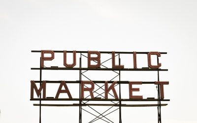 Large outdoor sign showing the words 'Public market'